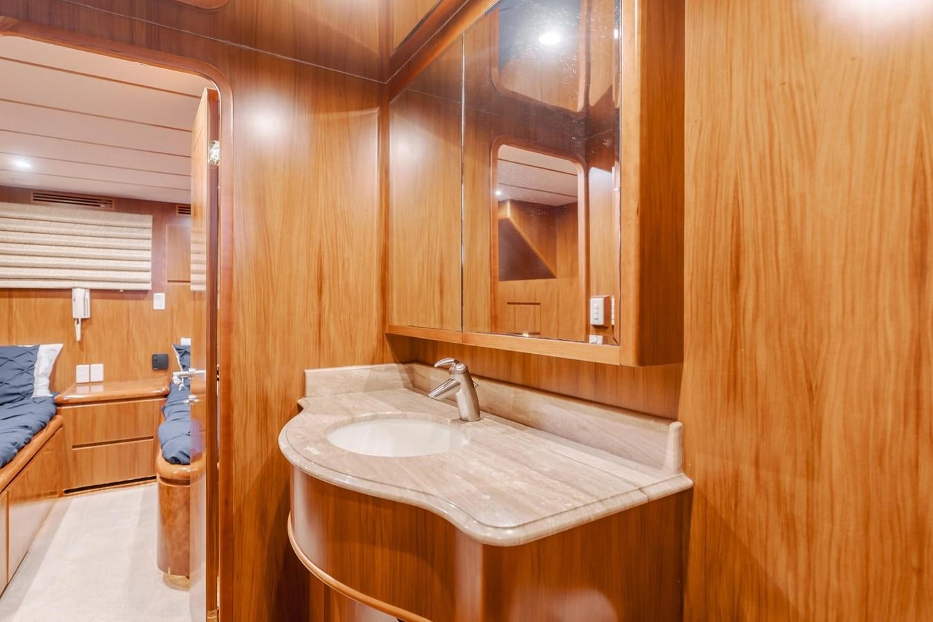 a bathroom with a sink and a mirror aboard MONEY CAT Yacht for Sale