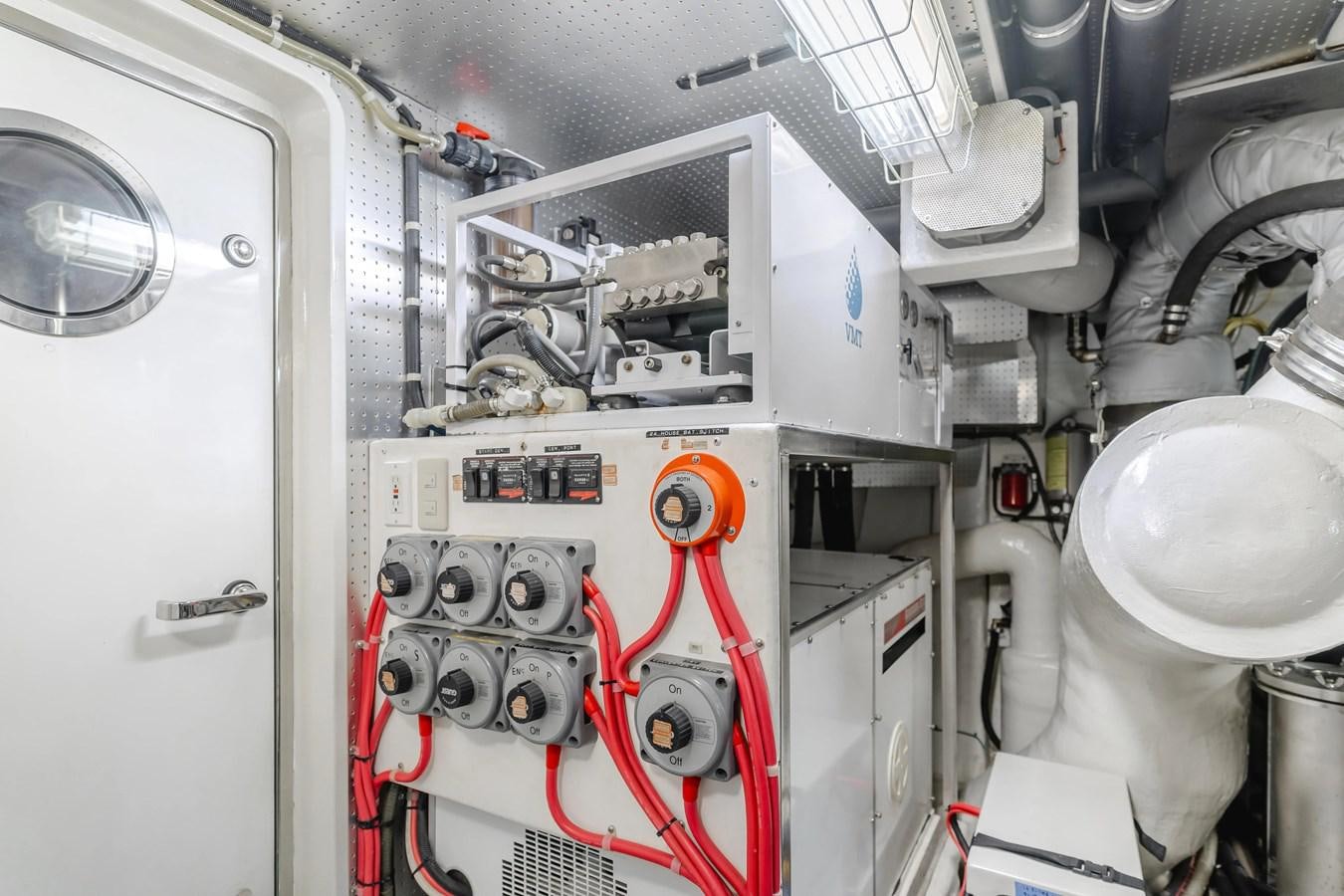 a white machine with red wires aboard MONEY CAT Yacht for Sale