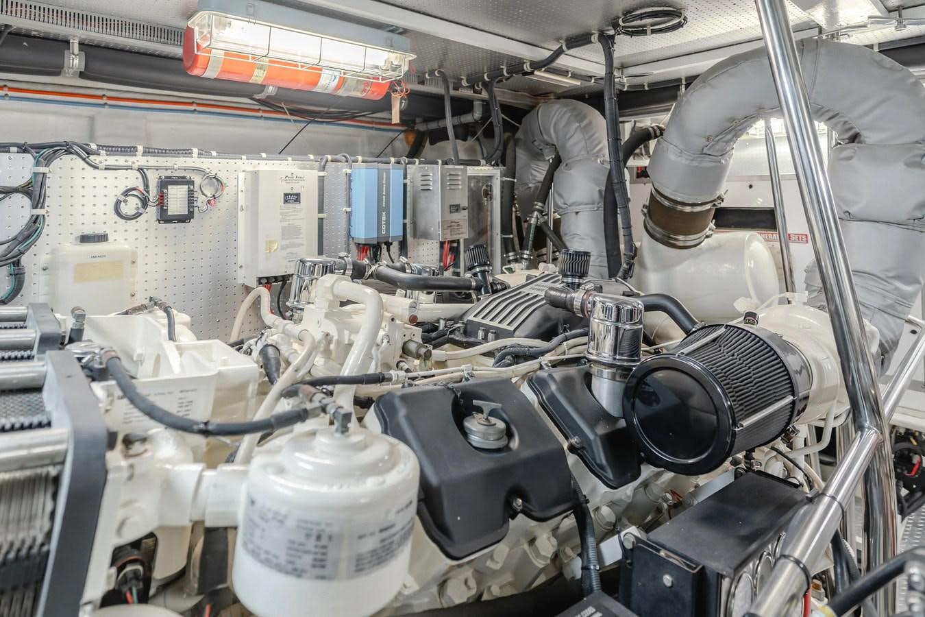 a machine with a large metal cylinder aboard MONEY CAT Yacht for Sale