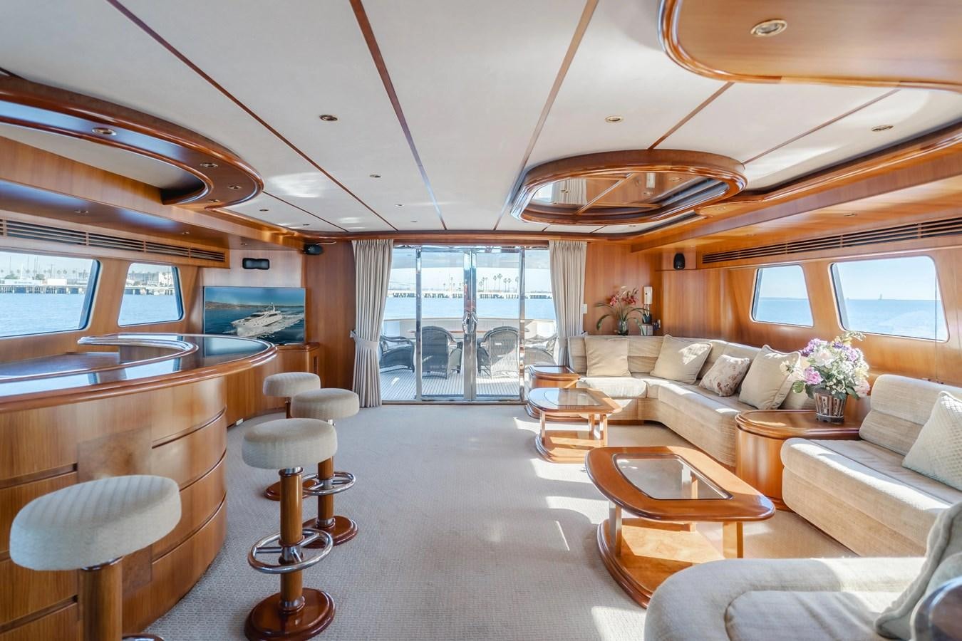 a living room with a large window aboard MONEY CAT Yacht for Sale