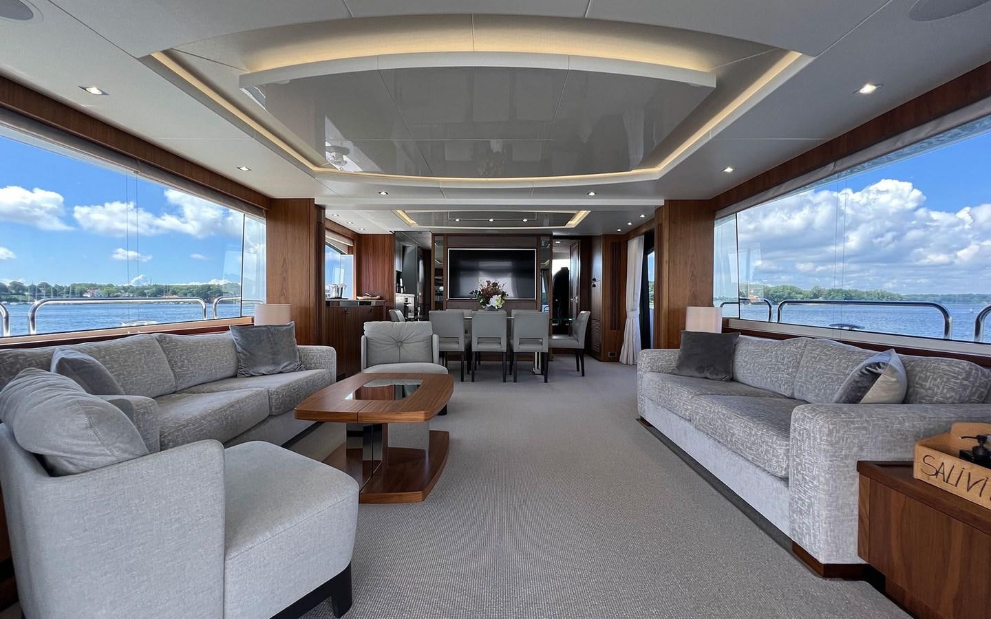 a living room with a large window aboard SALIVITI Yacht for Sale