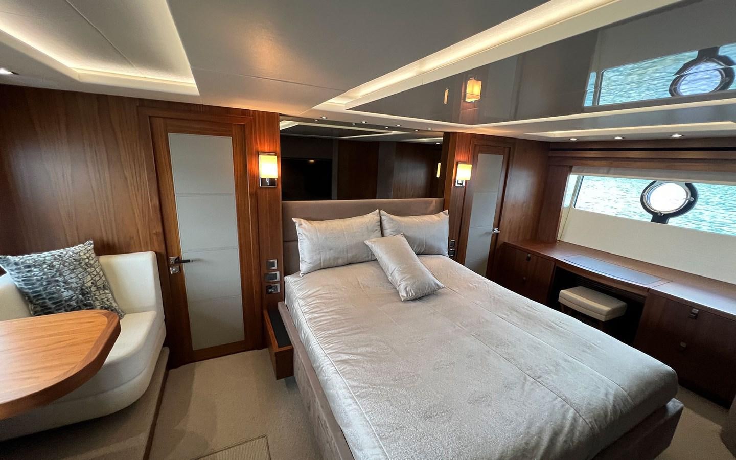 a room with a bed and a desk aboard SALIVITI Yacht for Sale