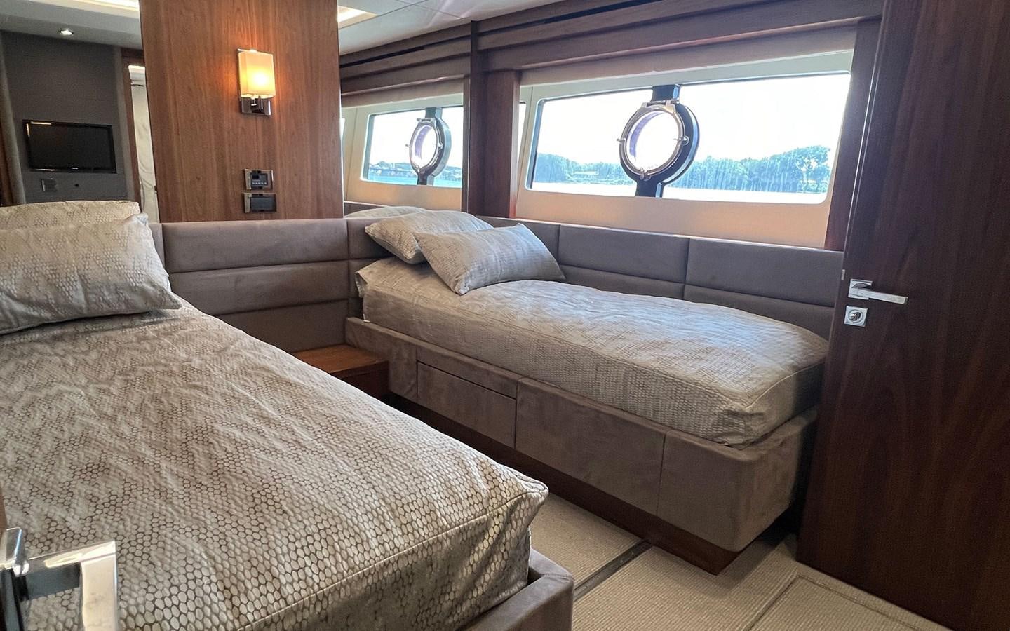 a room with a bed and a window aboard SALIVITI Yacht for Sale