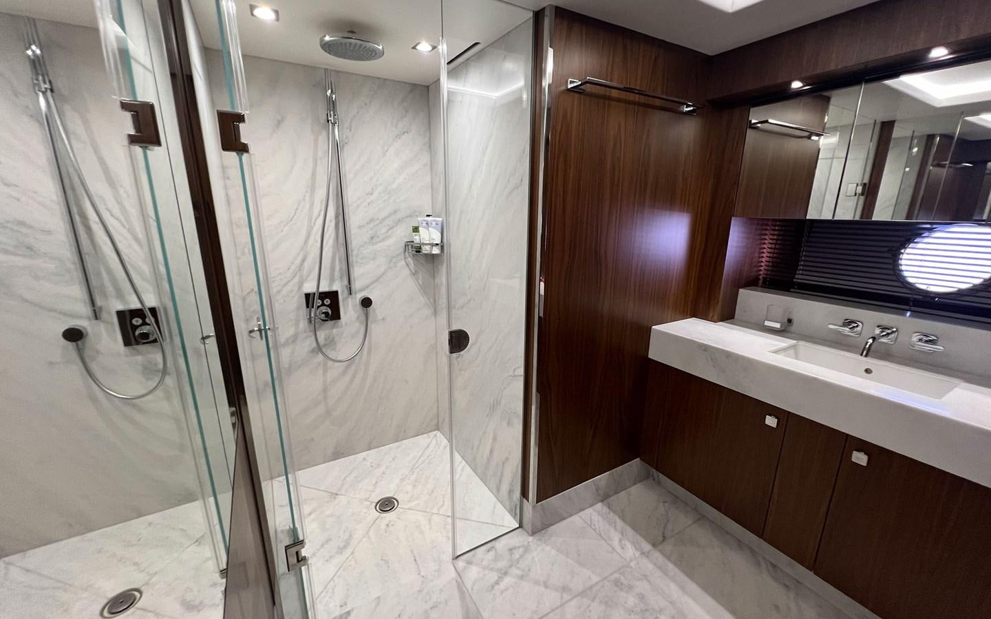 a bathroom with a shower unit and sink aboard SALIVITI Yacht for Sale