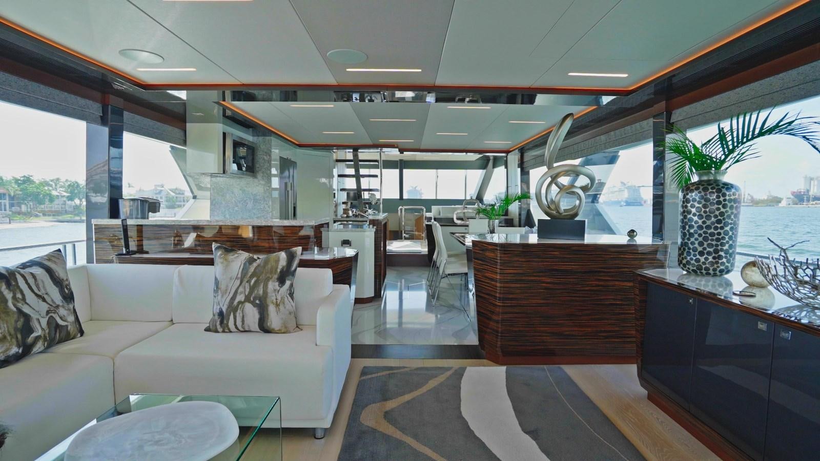 a living room with a couch and a table aboard PANACEA Yacht for Sale