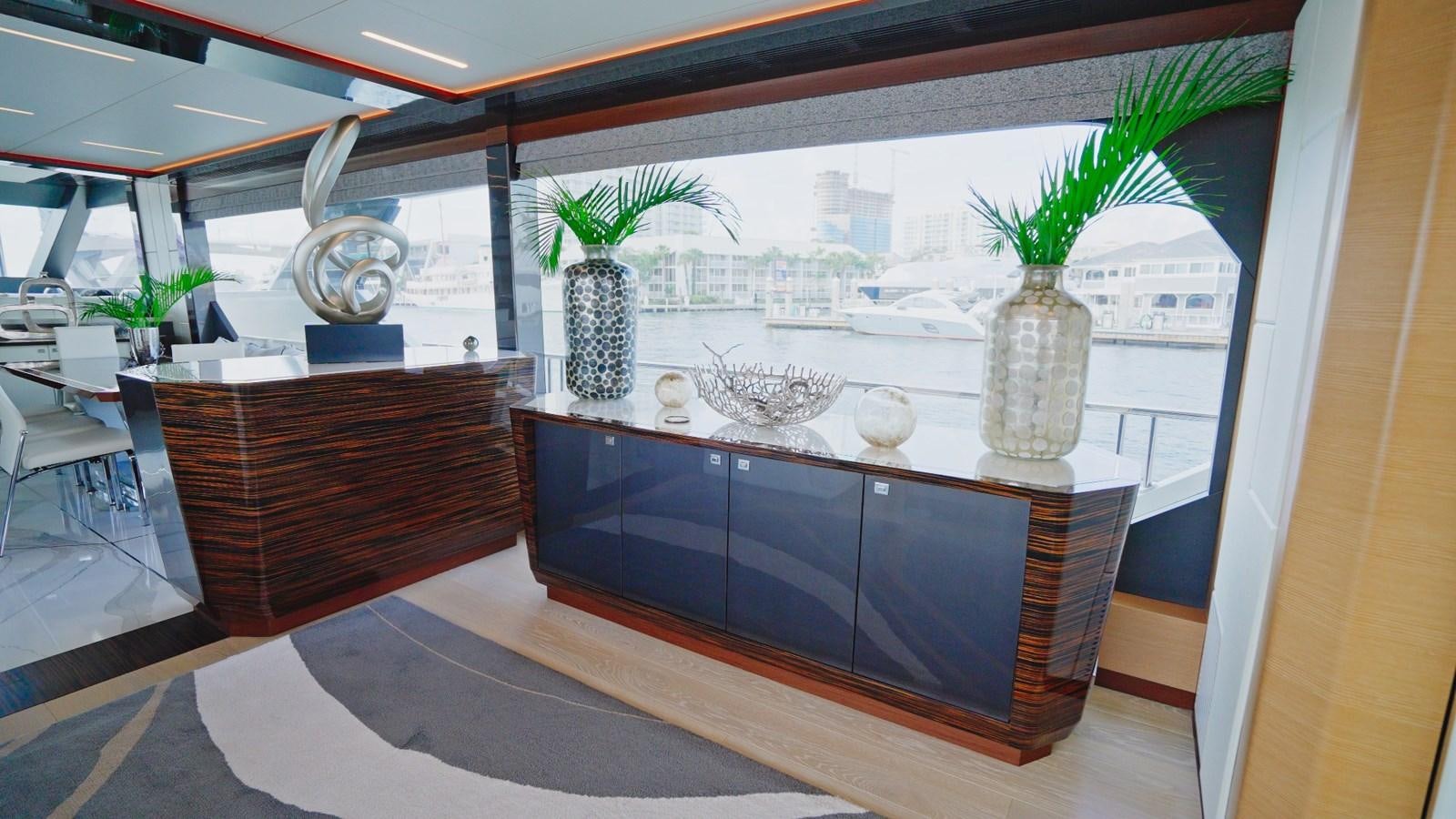 a room with a table and chairs aboard PANACEA Yacht for Sale