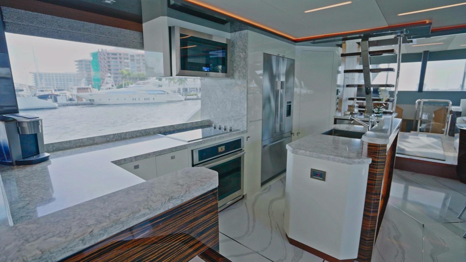a kitchen with a large window aboard PANACEA Yacht for Sale