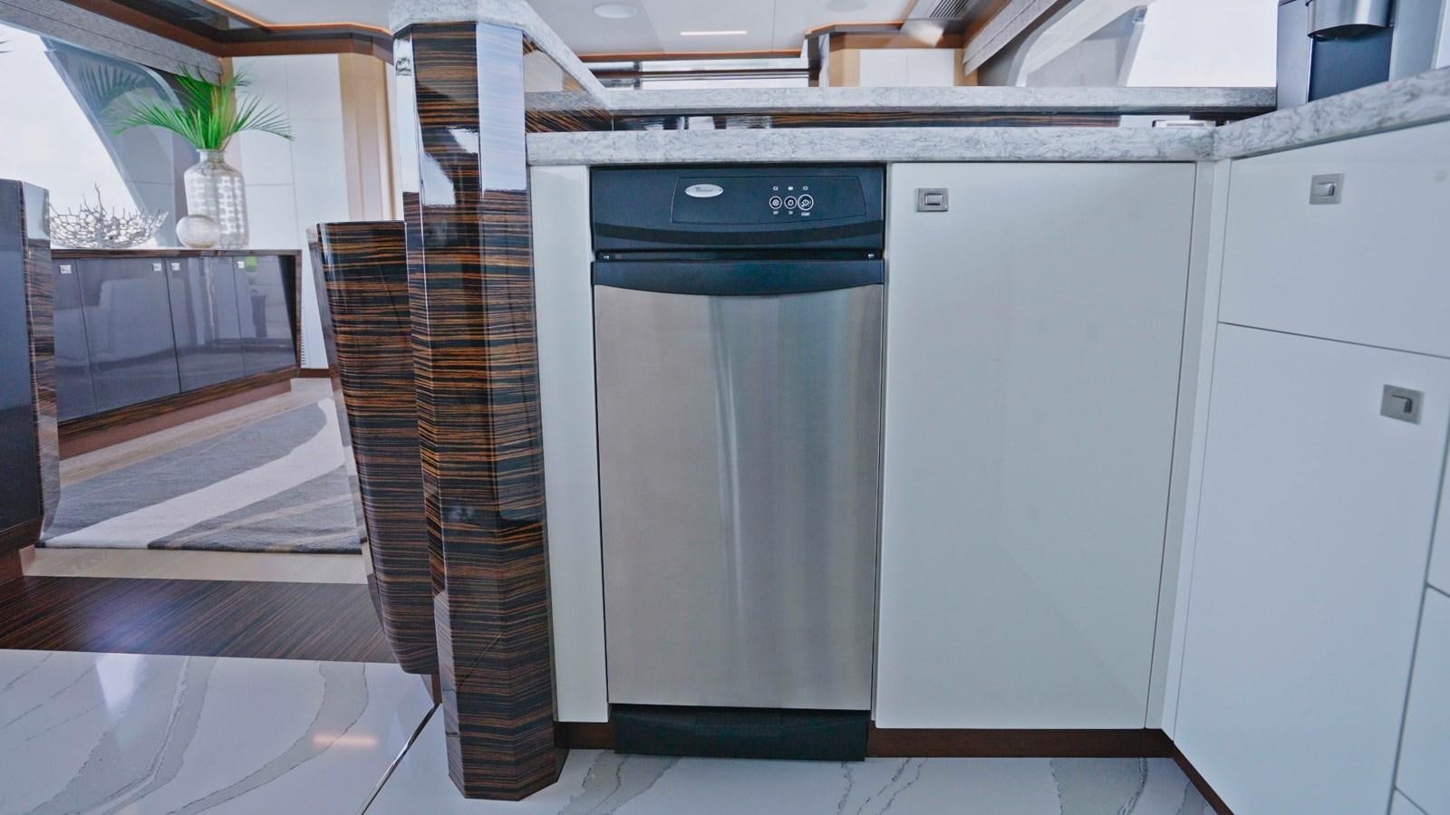 a kitchen with a fridge aboard PANACEA Yacht for Sale
