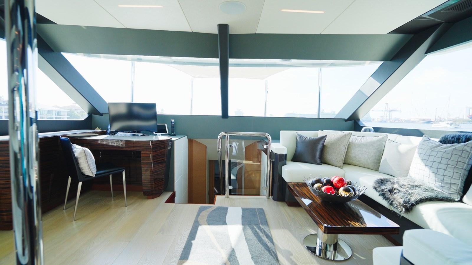 a living room with a large window aboard PANACEA Yacht for Sale