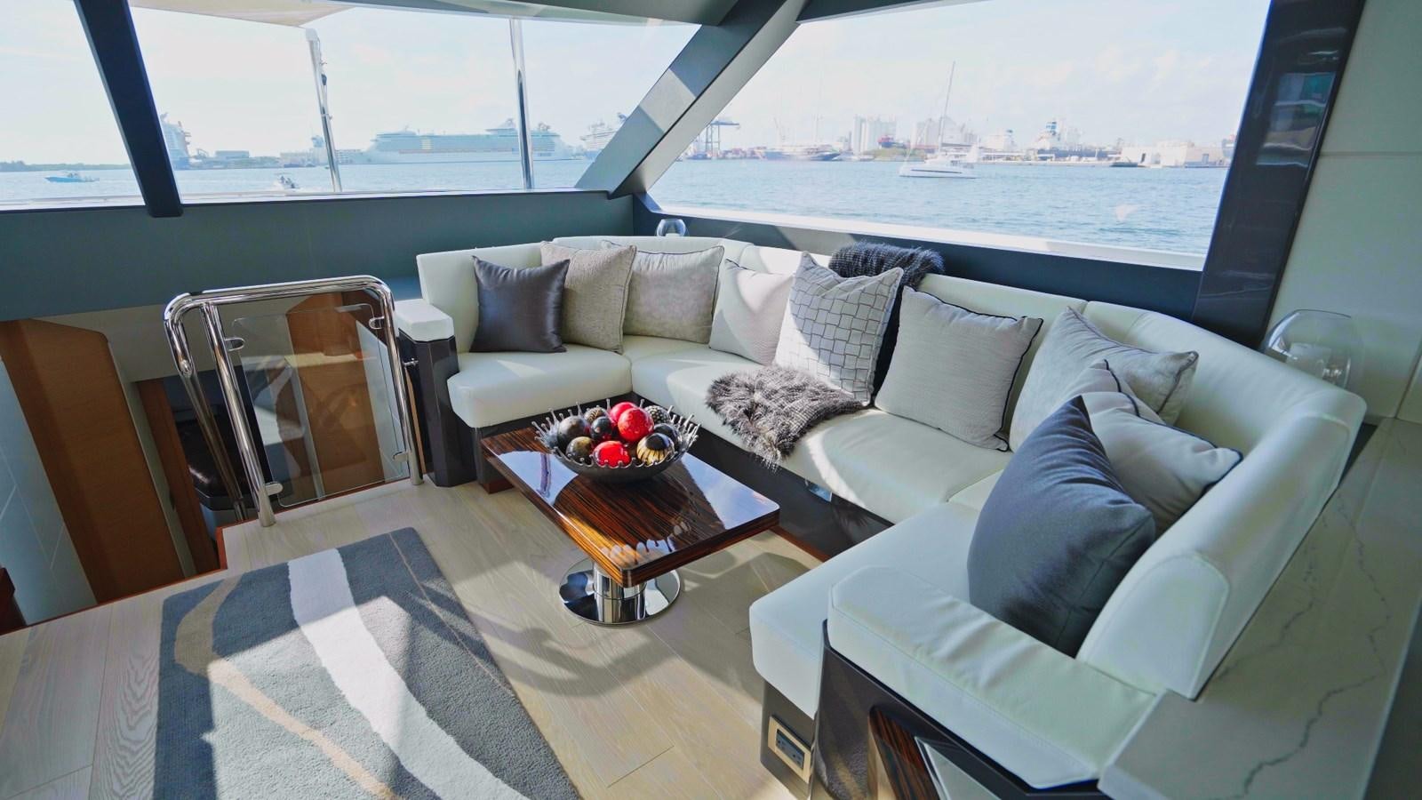 a living room with a large window aboard PANACEA Yacht for Sale
