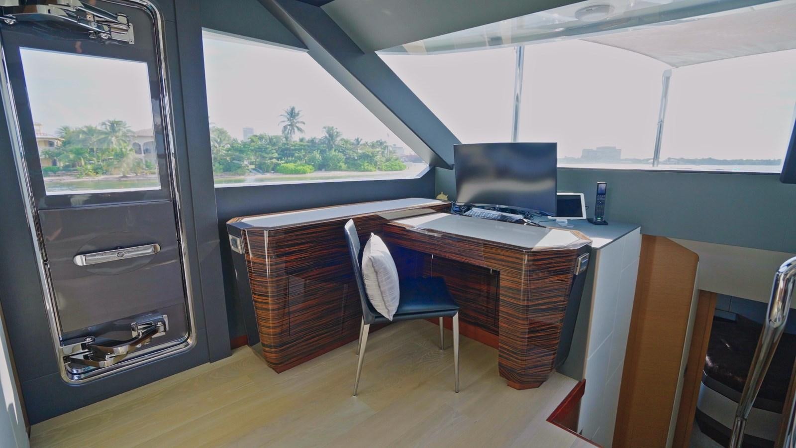 a room with a desk and a chair aboard PANACEA Yacht for Sale