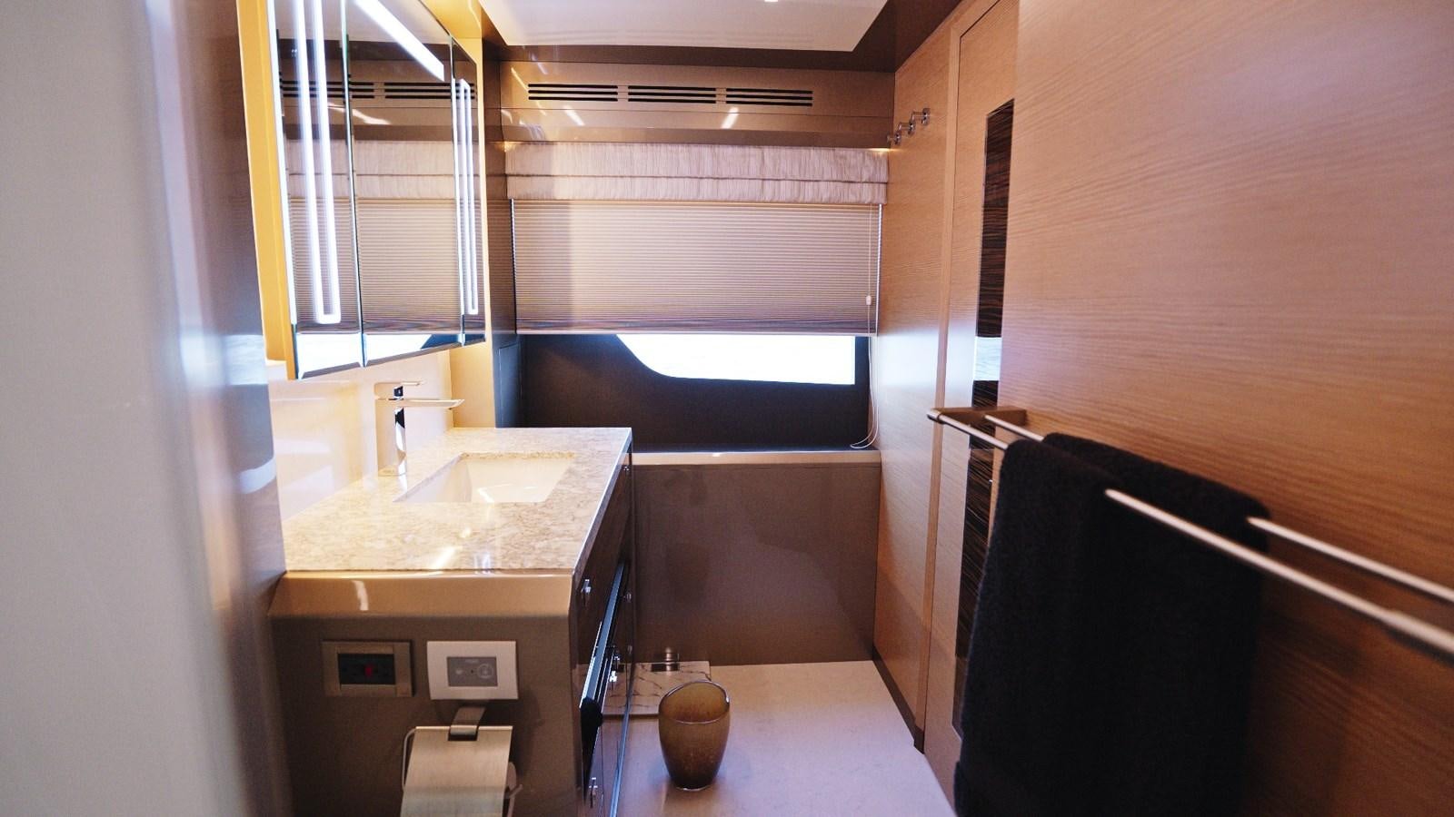 a kitchen with a countertop sink and cabinets aboard PANACEA Yacht for Sale