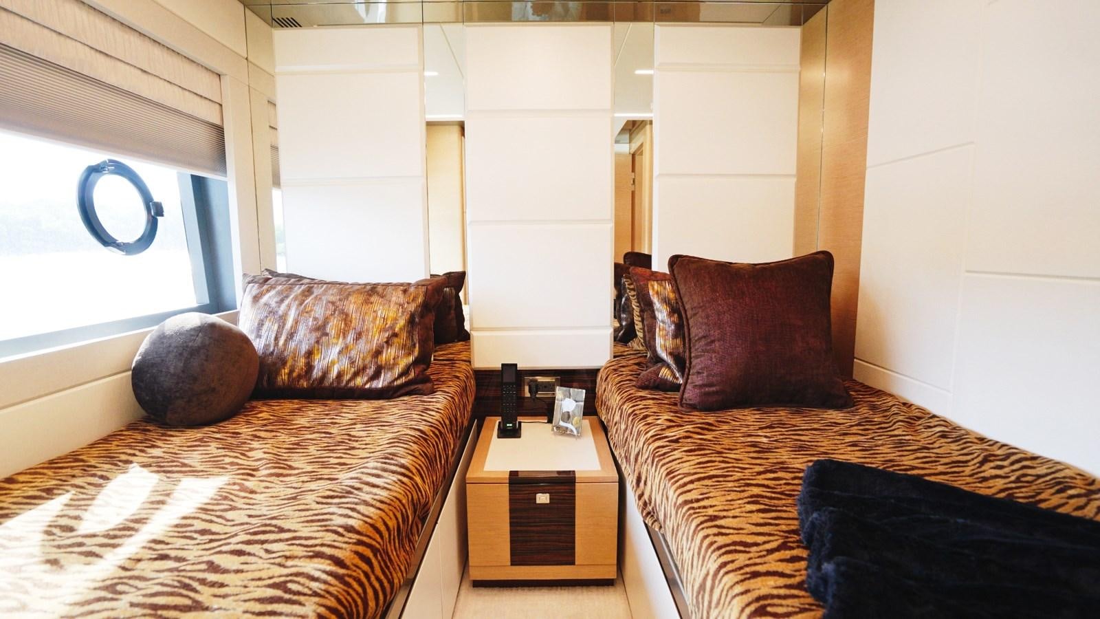 a bedroom with two beds aboard PANACEA Yacht for Sale