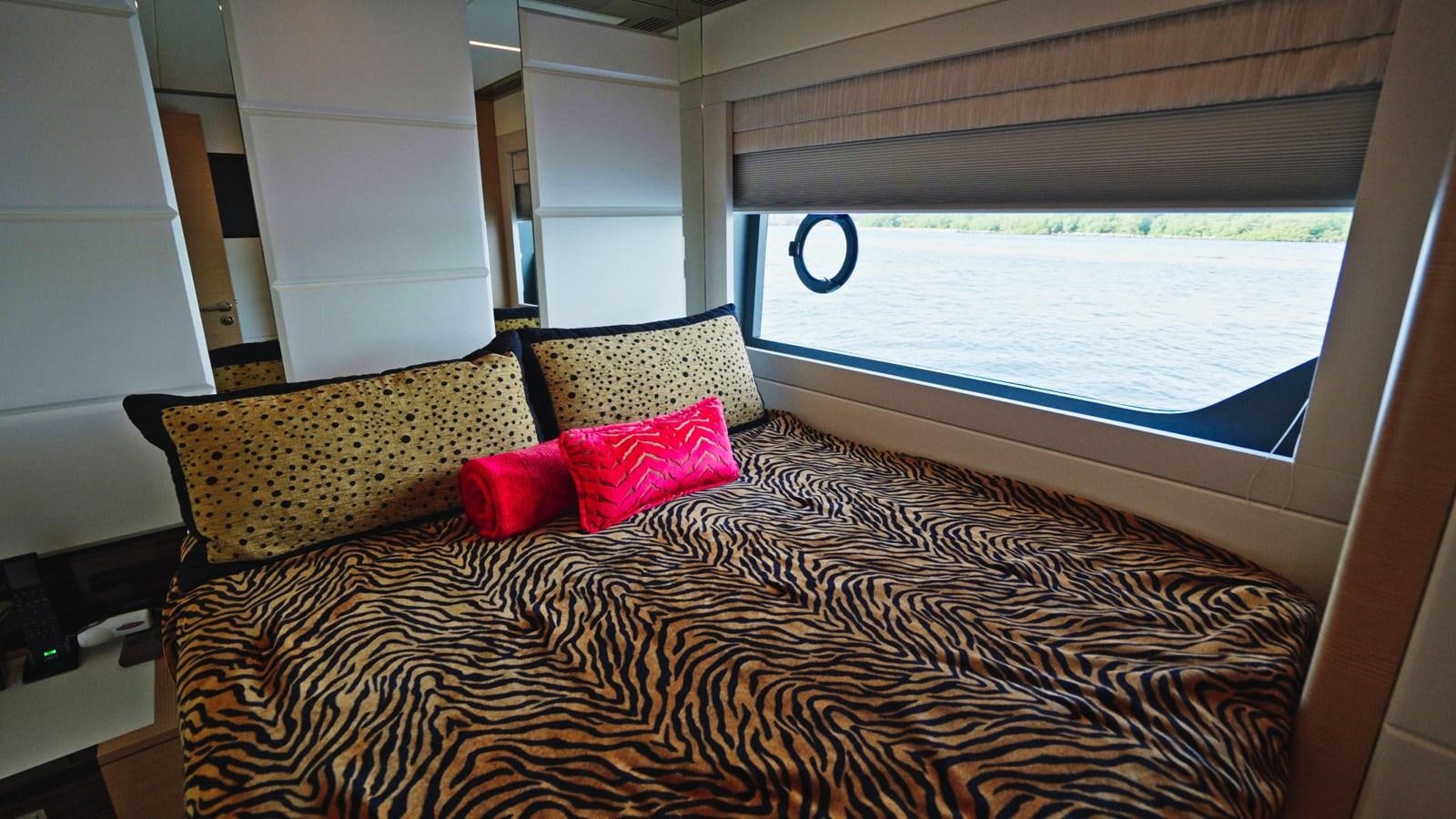 a bed with pillows on it aboard PANACEA Yacht for Sale