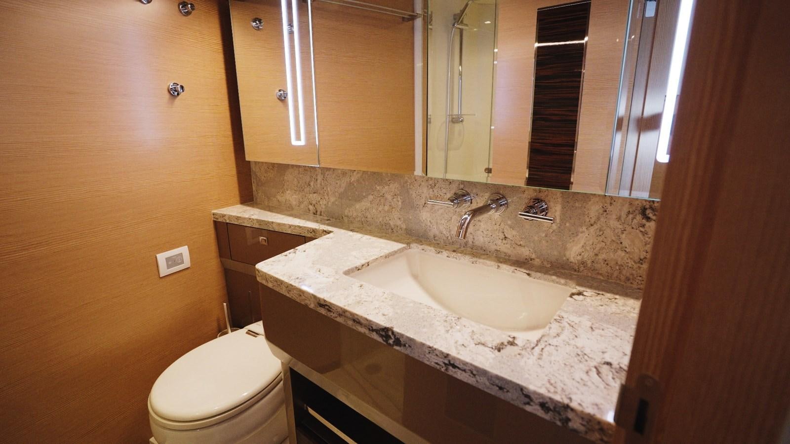 a bathroom with a sink and a toilet aboard PANACEA Yacht for Sale
