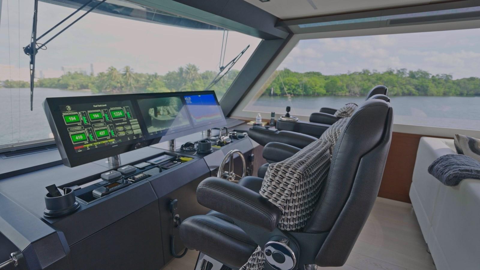 a car with a computer and a chair aboard PANACEA Yacht for Sale