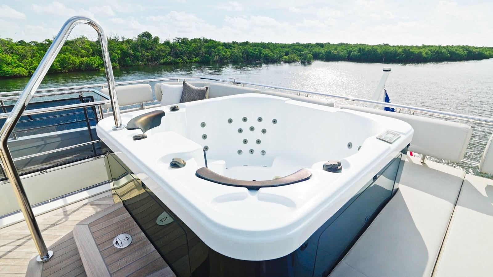 a white boat on a lake aboard PANACEA Yacht for Sale