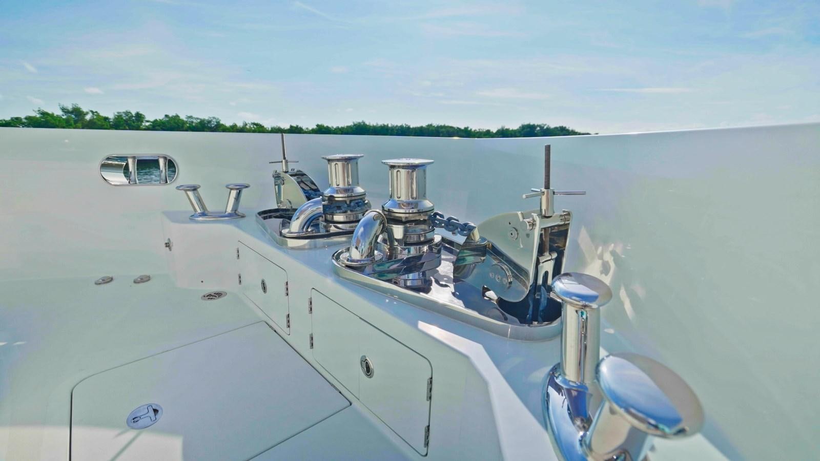 a large white boat with a metal engine on the front aboard PANACEA Yacht for Sale