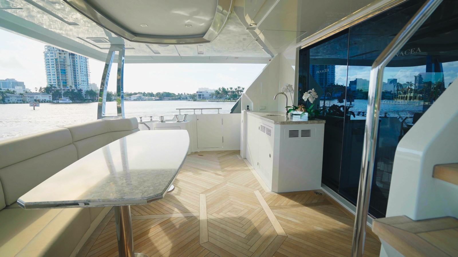 a room with a table and chairs aboard PANACEA Yacht for Sale