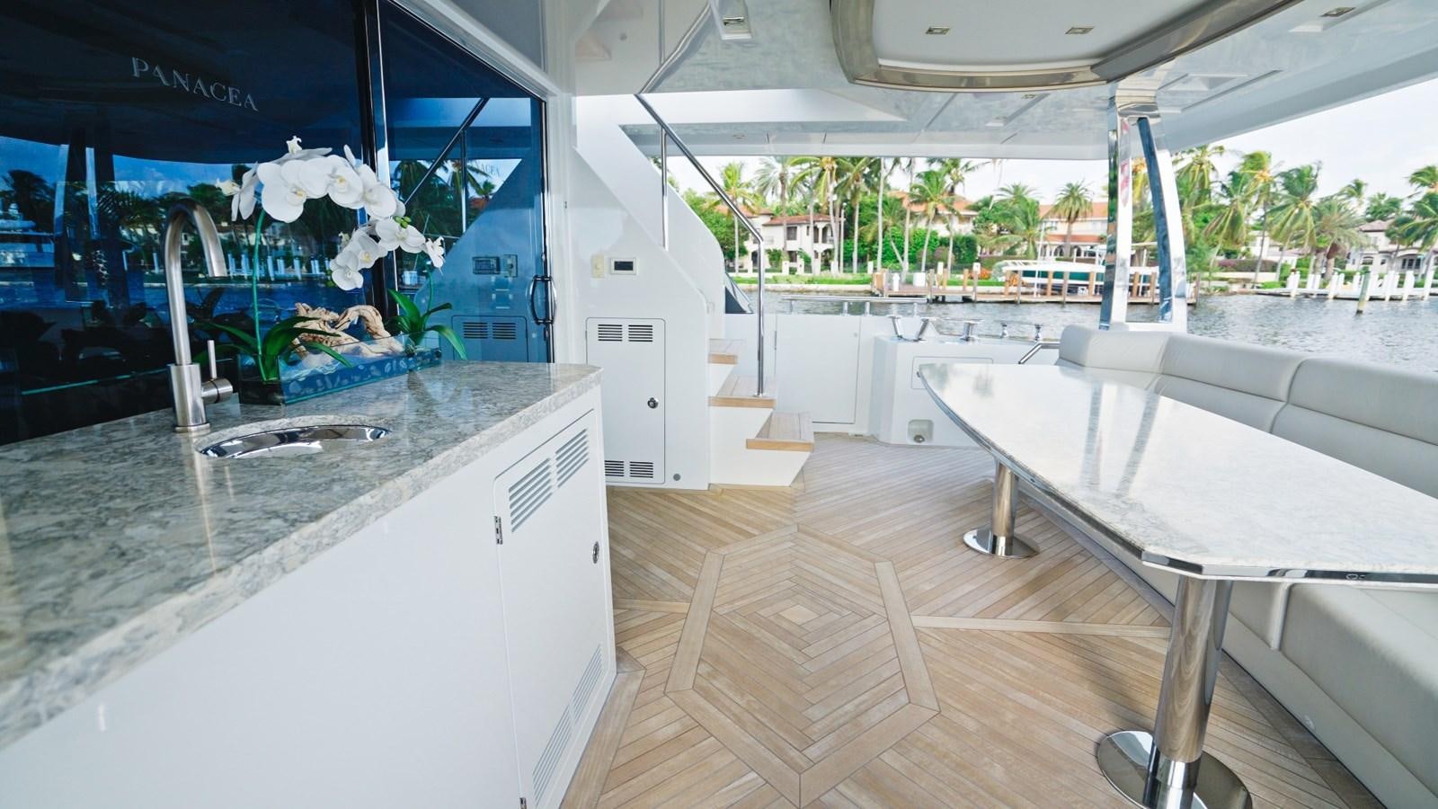 a kitchen with a table and chairs aboard PANACEA Yacht for Sale