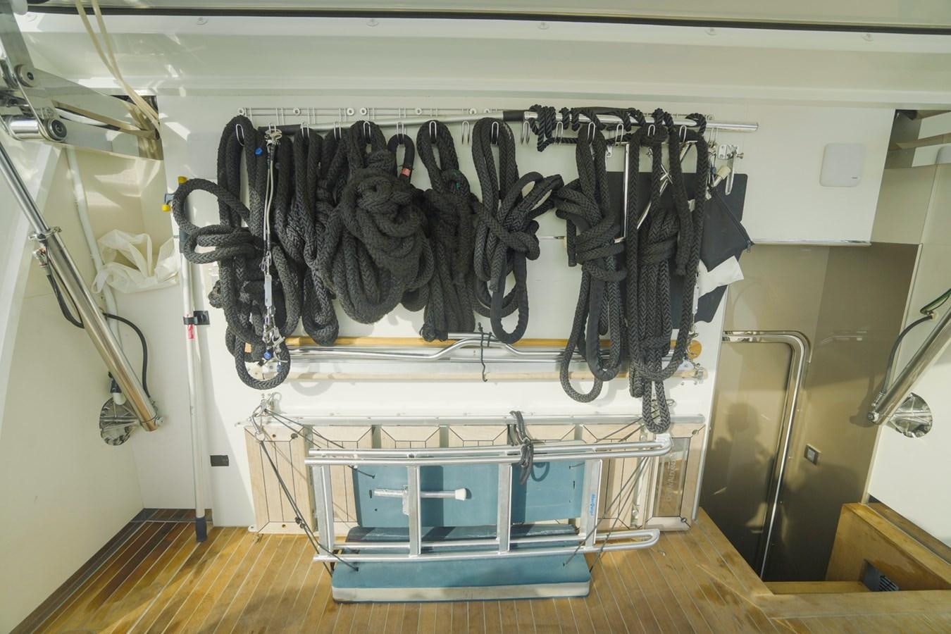 a rack of clothes on a wall aboard PANACEA Yacht for Sale
