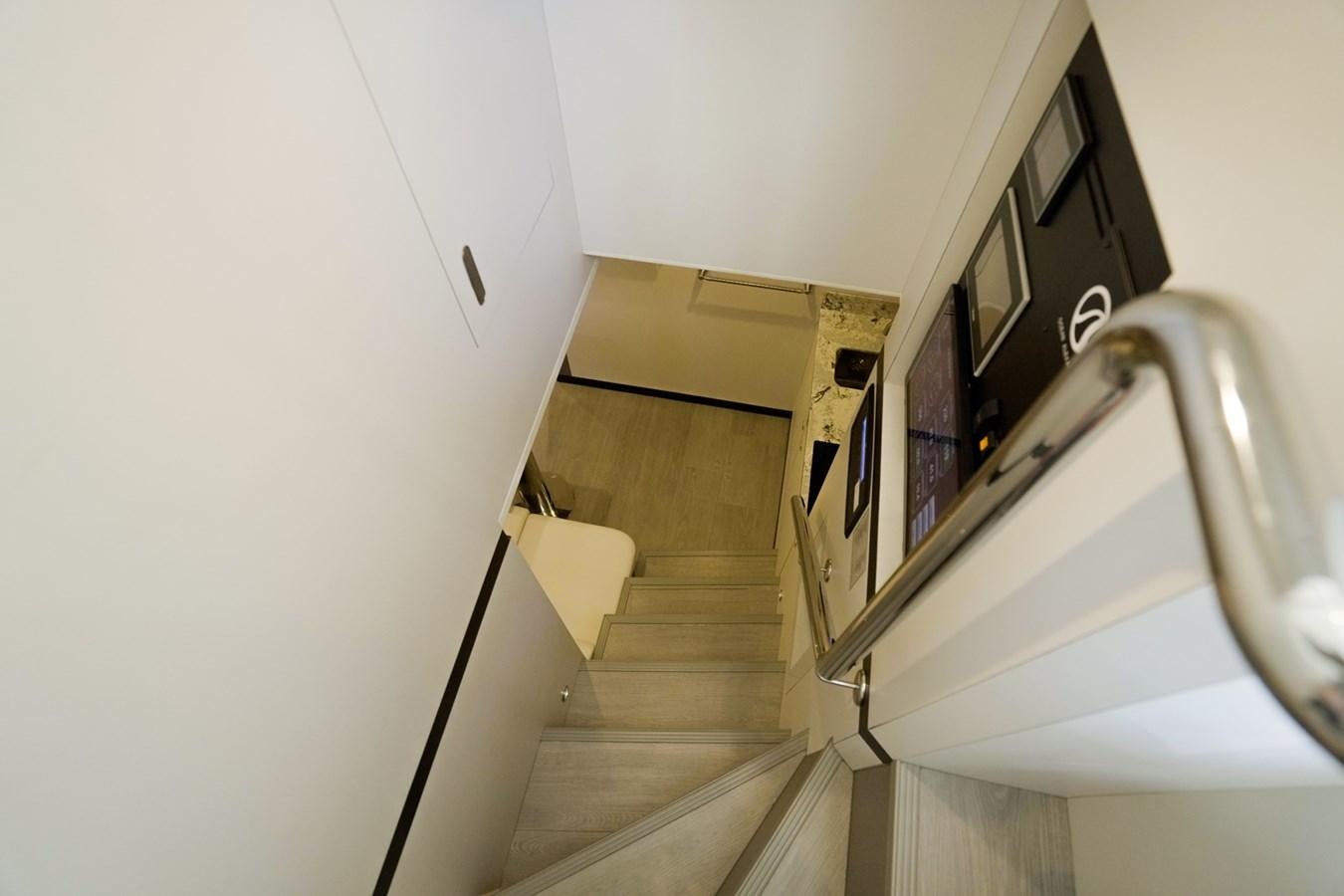 a staircase with a metal railing aboard PANACEA Yacht for Sale