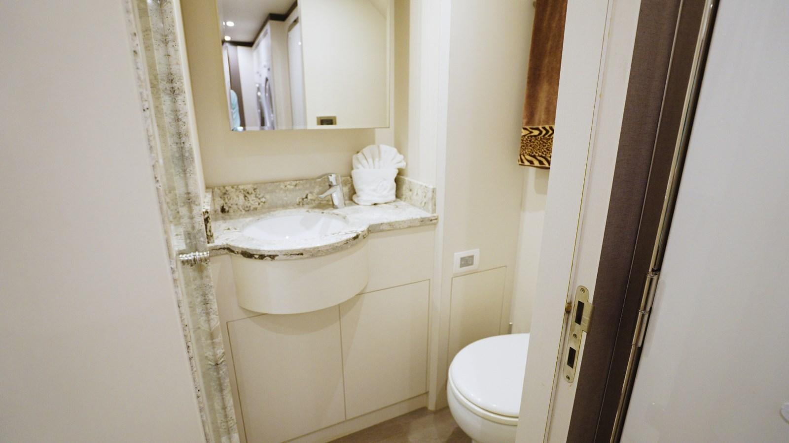 a bathroom with a sink and toilet aboard PANACEA Yacht for Sale