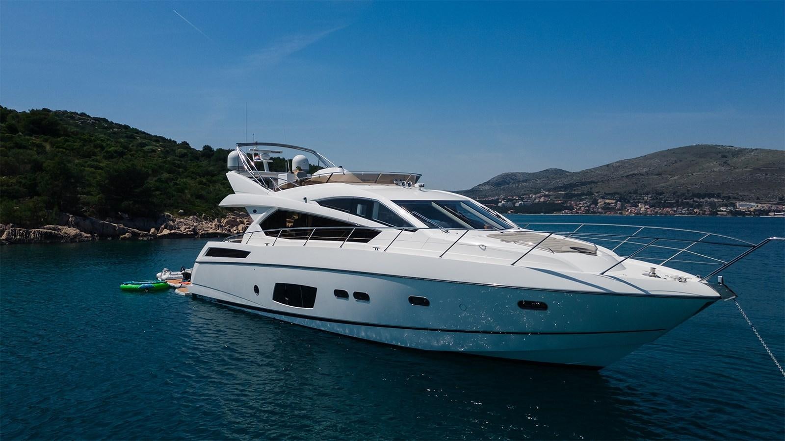 a white yacht in the water aboard CARDANO Yacht for Sale