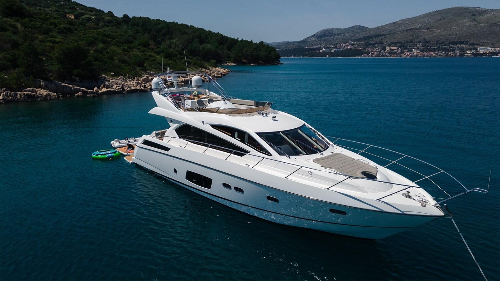 a white yacht in the water aboard CARDANO Yacht for Sale