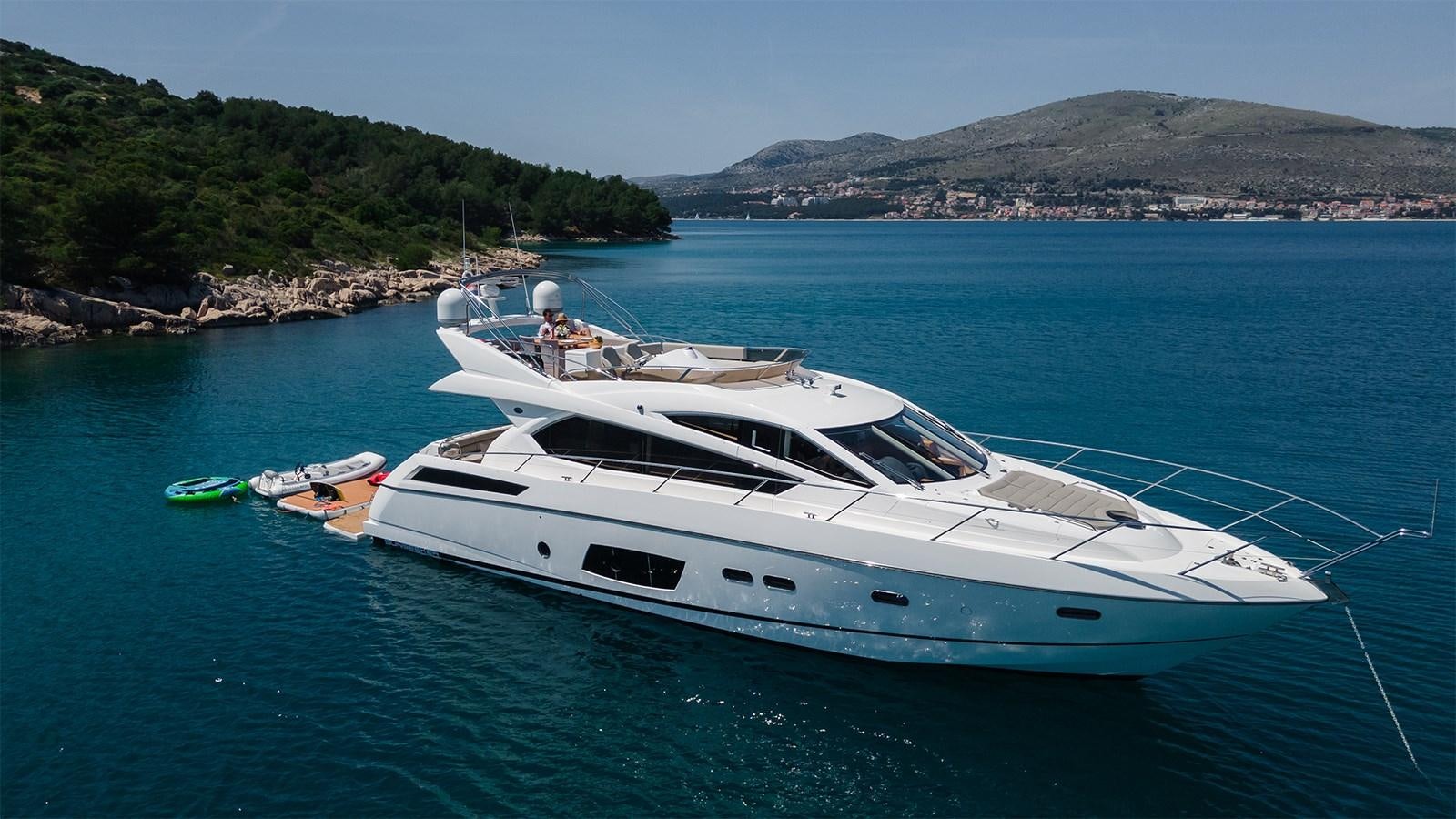 a white boat on the water aboard CARDANO Yacht for Sale