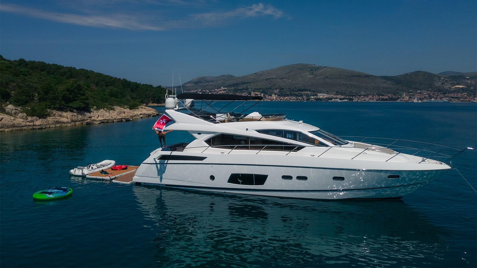a white yacht in the water aboard CARDANO Yacht for Sale