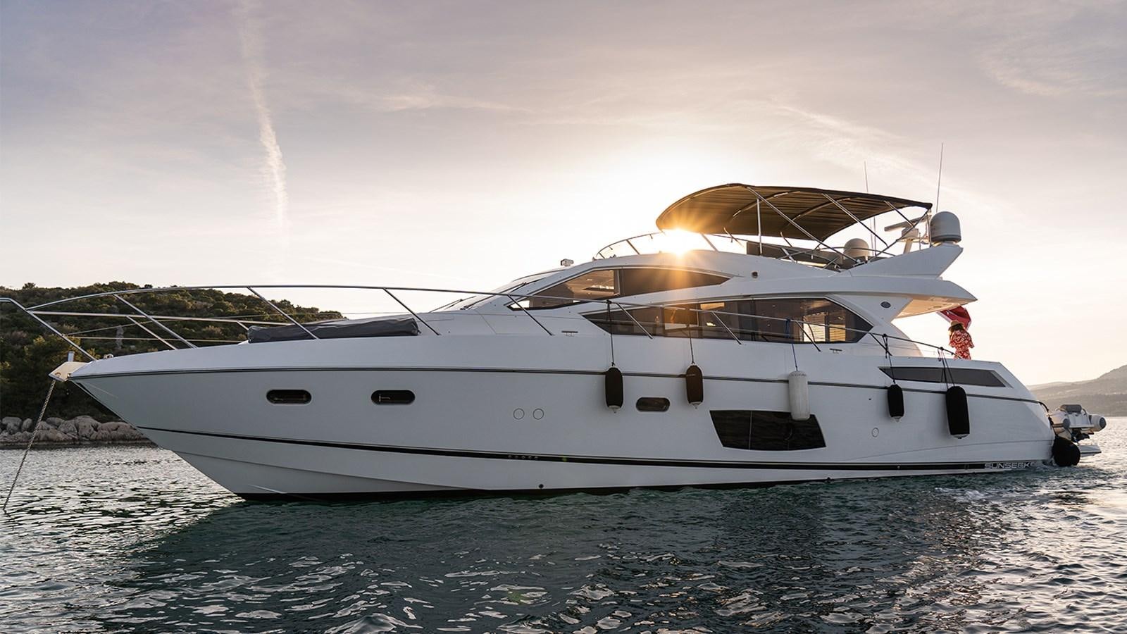a white yacht on the water aboard CARDANO Yacht for Sale