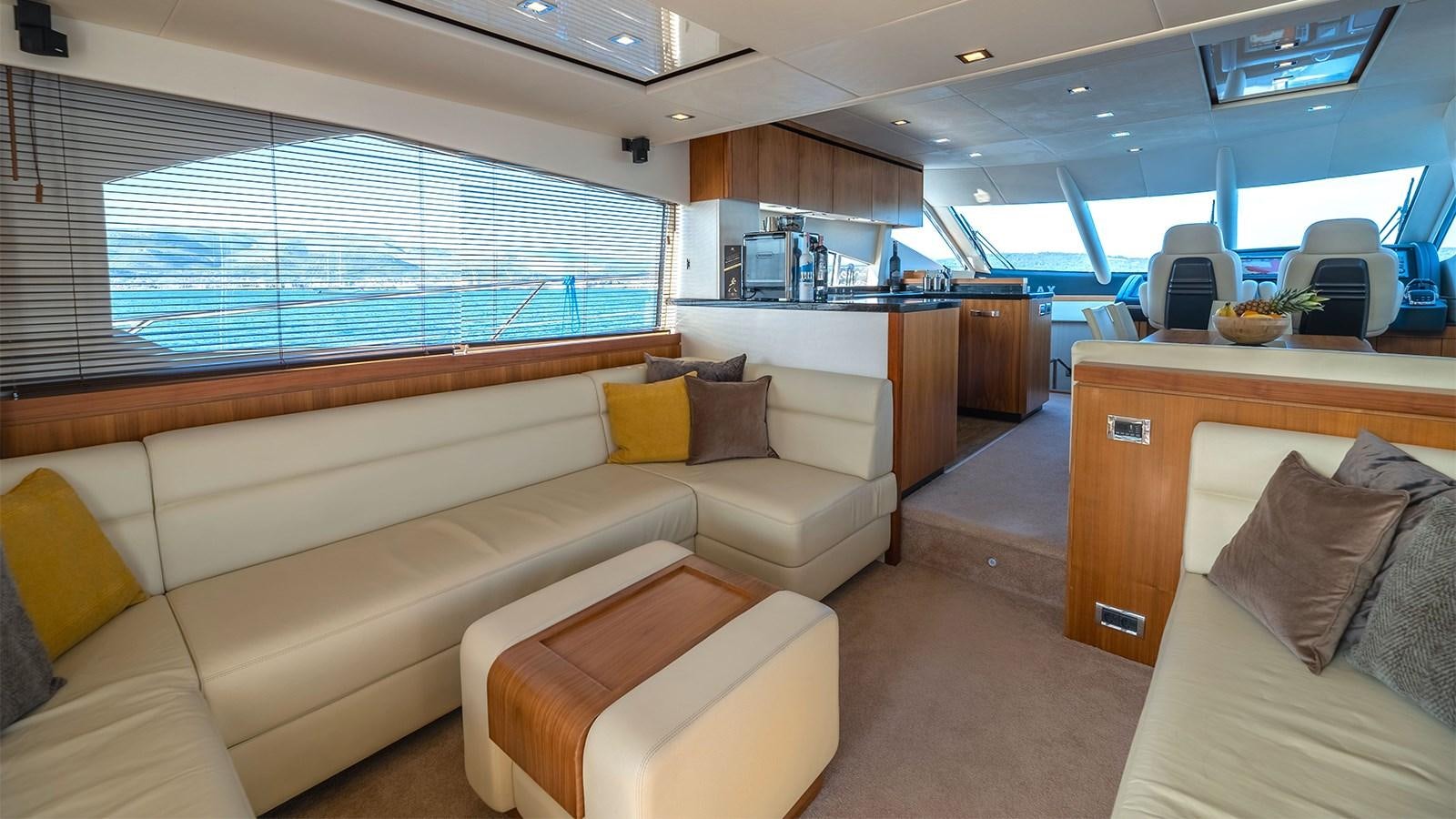 a room with a couch and a window aboard CARDANO Yacht for Sale