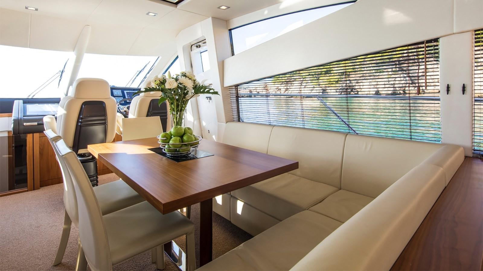 a room with a table and chairs aboard CARDANO Yacht for Sale