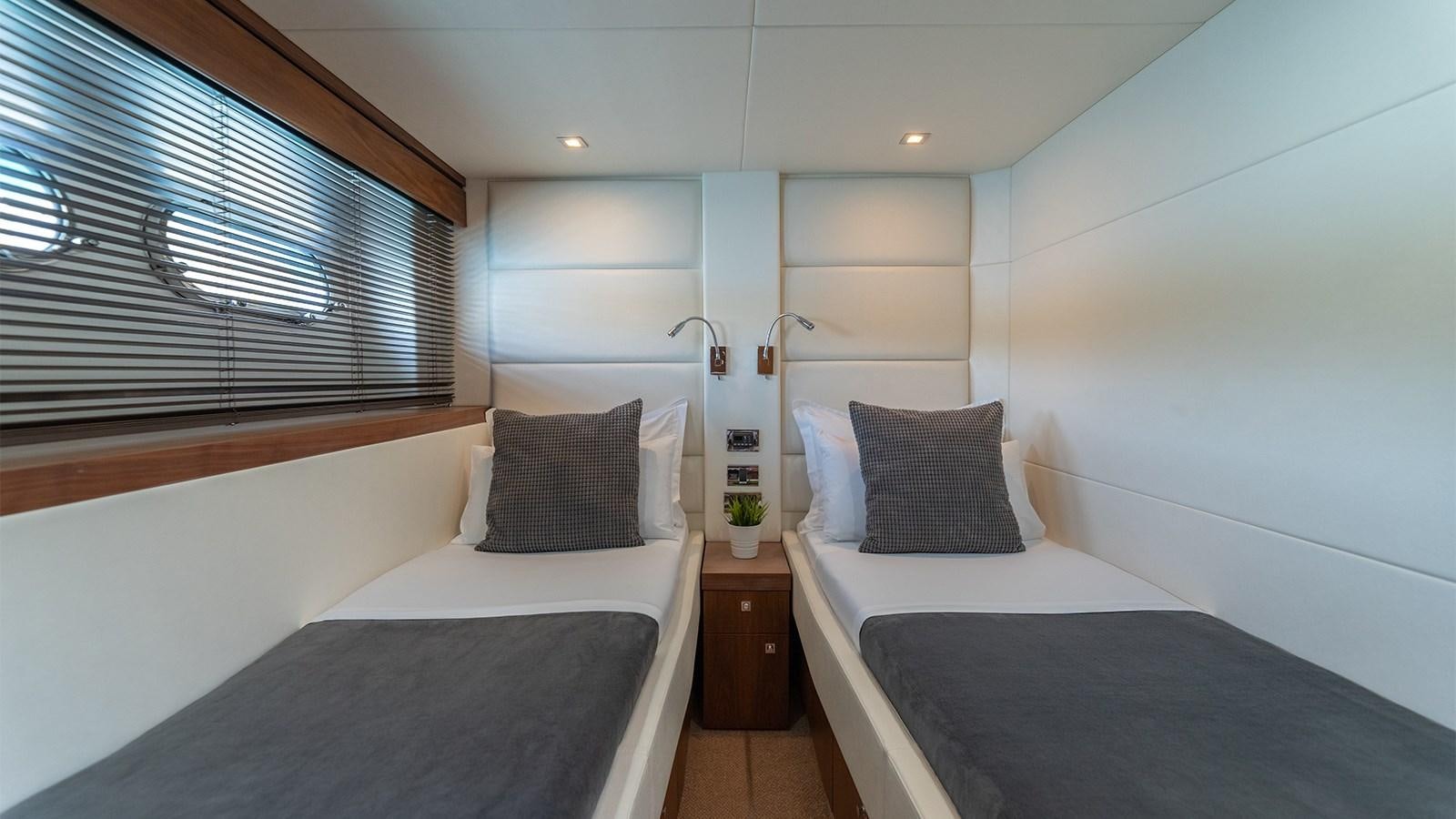 a room with two beds aboard CARDANO Yacht for Sale