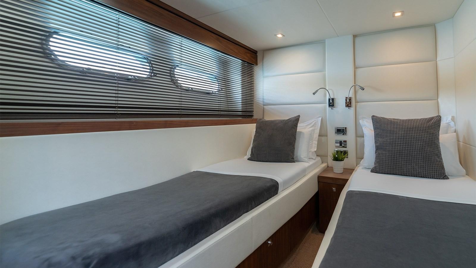 a room with two beds aboard CARDANO Yacht for Sale