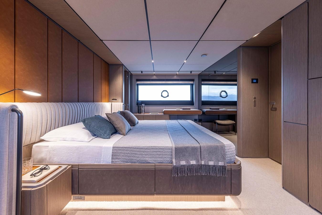 a bed in a room aboard FERRETTI  INFYNITO 90 Yacht for Sale