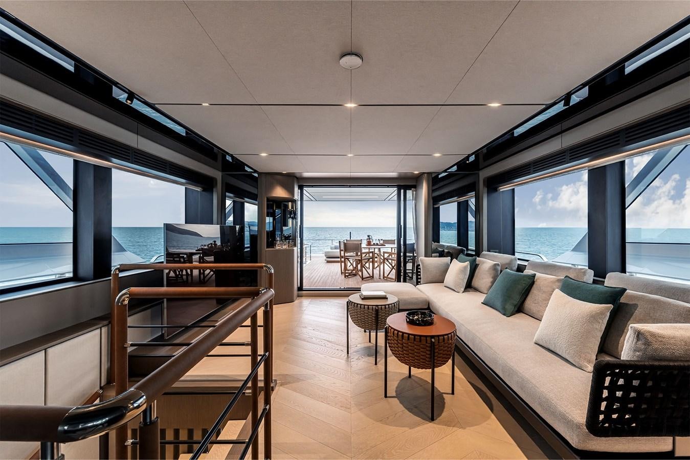a living room with a large window aboard FERRETTI  INFYNITO 90 Yacht for Sale