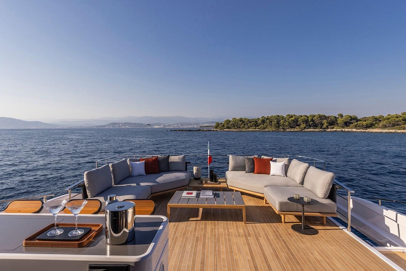 a deck with a couch and a table on it aboard FERRETTI  1000 SKYDECK Yacht for Sale