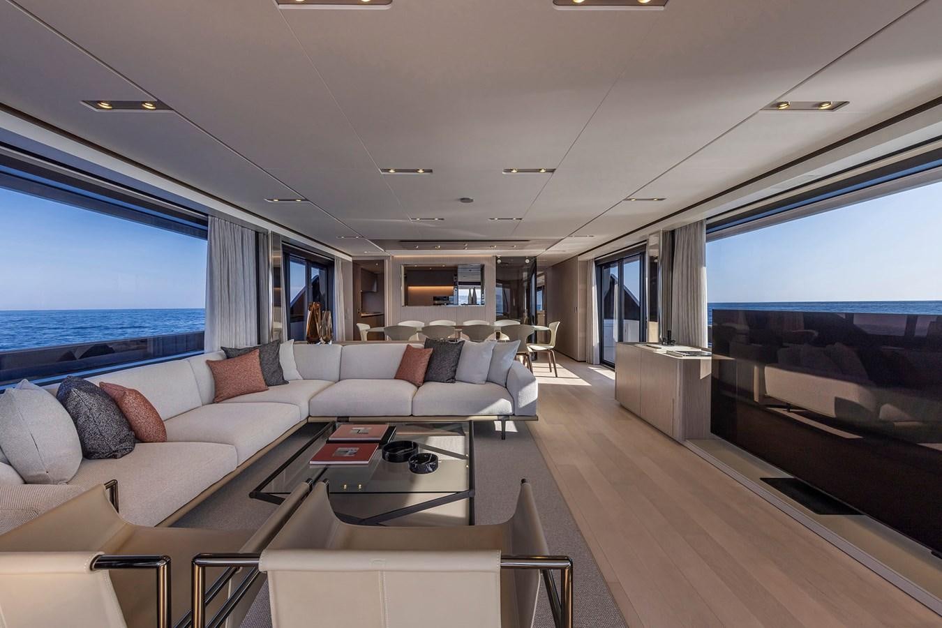 a living room with a large window aboard FERRETTI  1000 SKYDECK Yacht for Sale