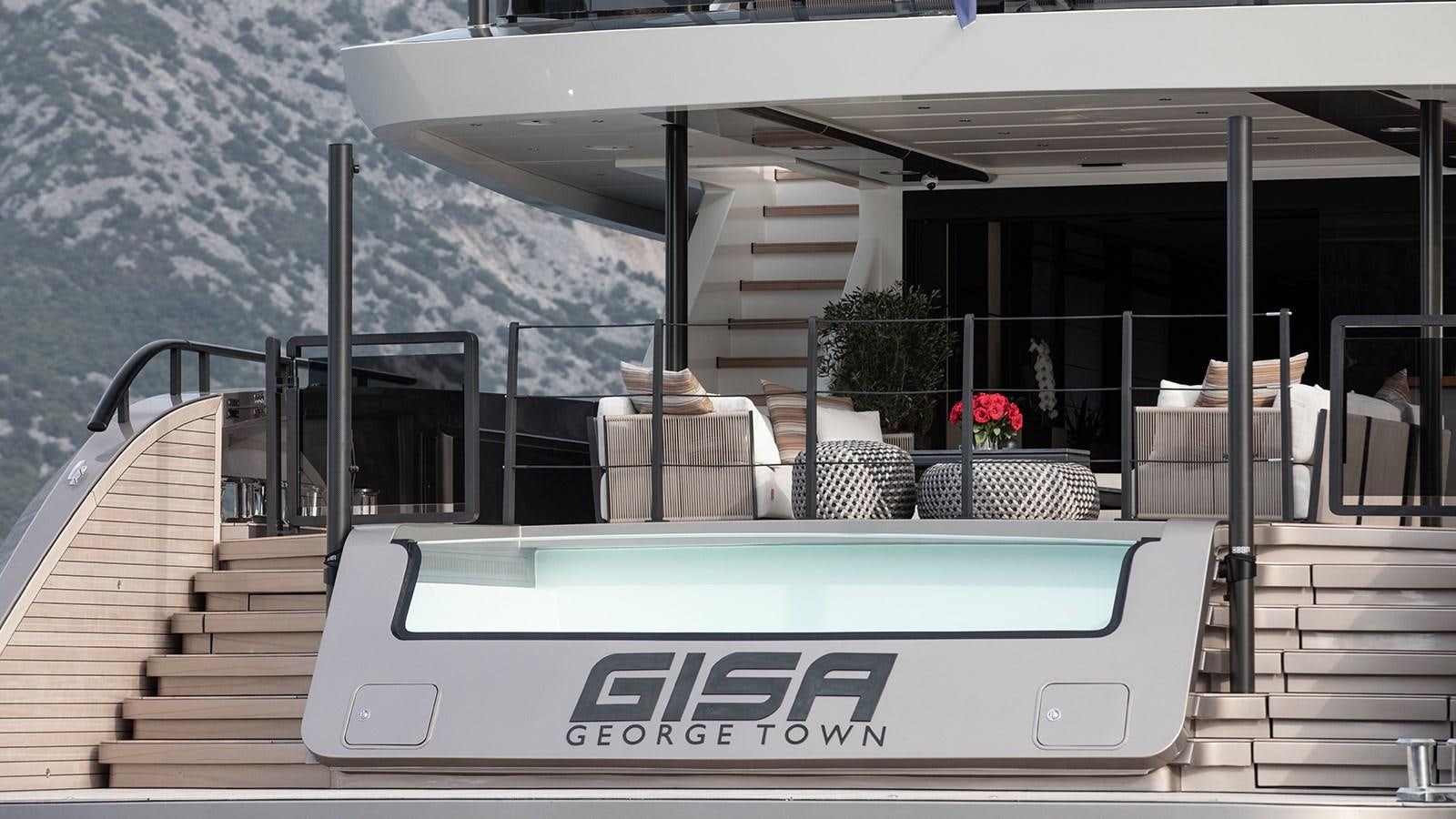 a swimming pool outside a building aboard GISA Yacht for Sale