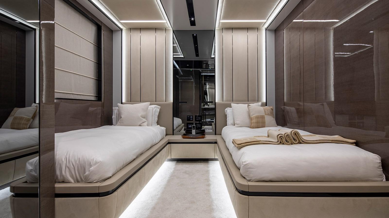 a room with a couple of beds aboard GISA Yacht for Sale