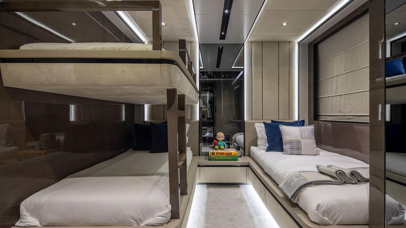 a room with a bed and a desk aboard GISA Yacht for Sale