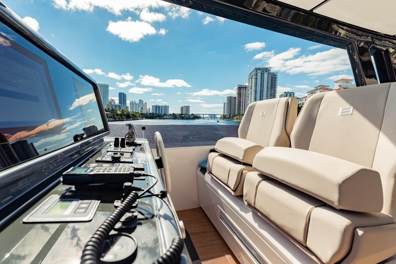 a car with a view of a city and water aboard VITTORIA Yacht for Sale