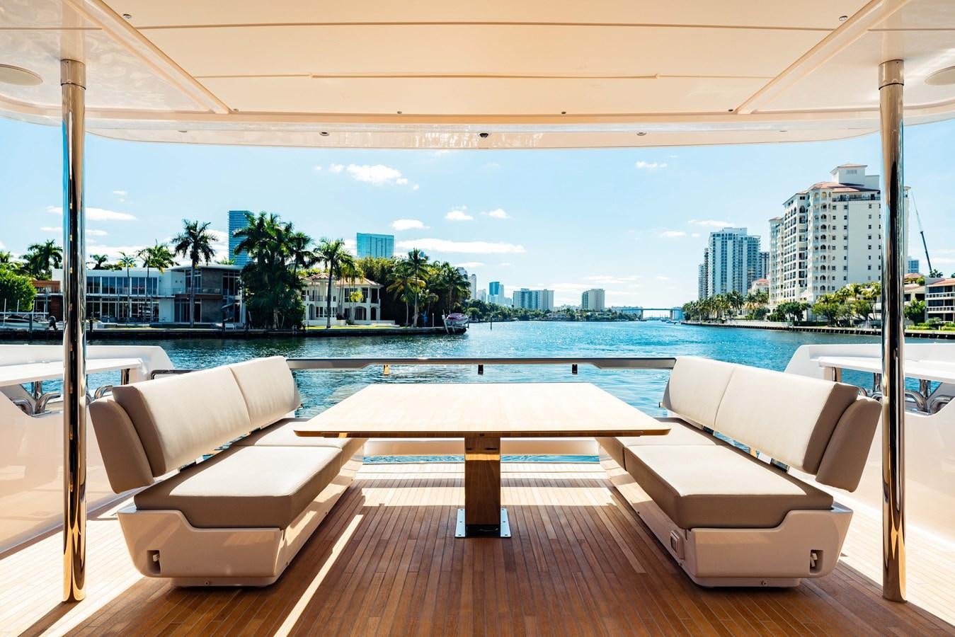 a room with a pool and a city in the background aboard VITTORIA Yacht for Sale
