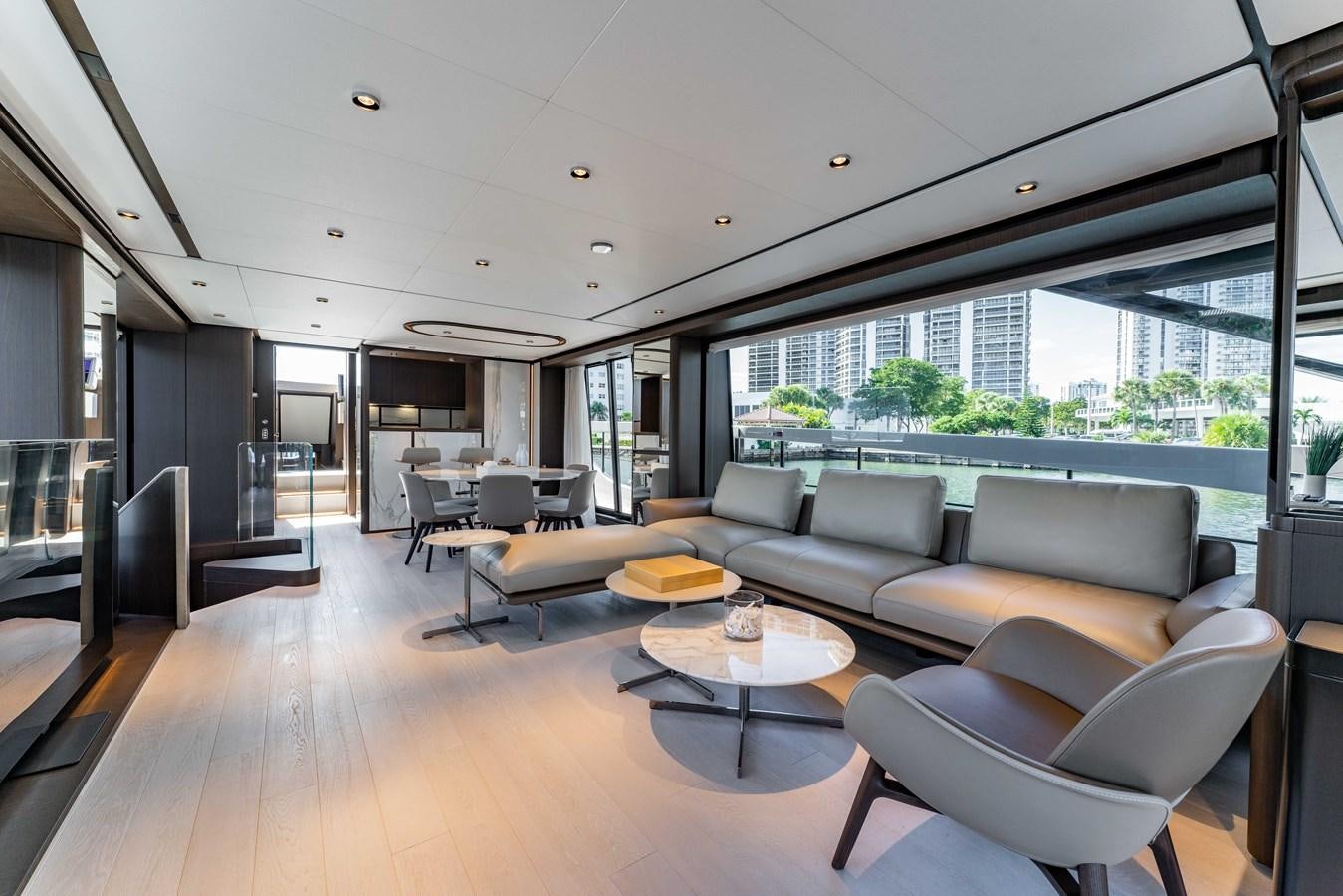 a living room with a large window aboard VITTORIA Yacht for Sale
