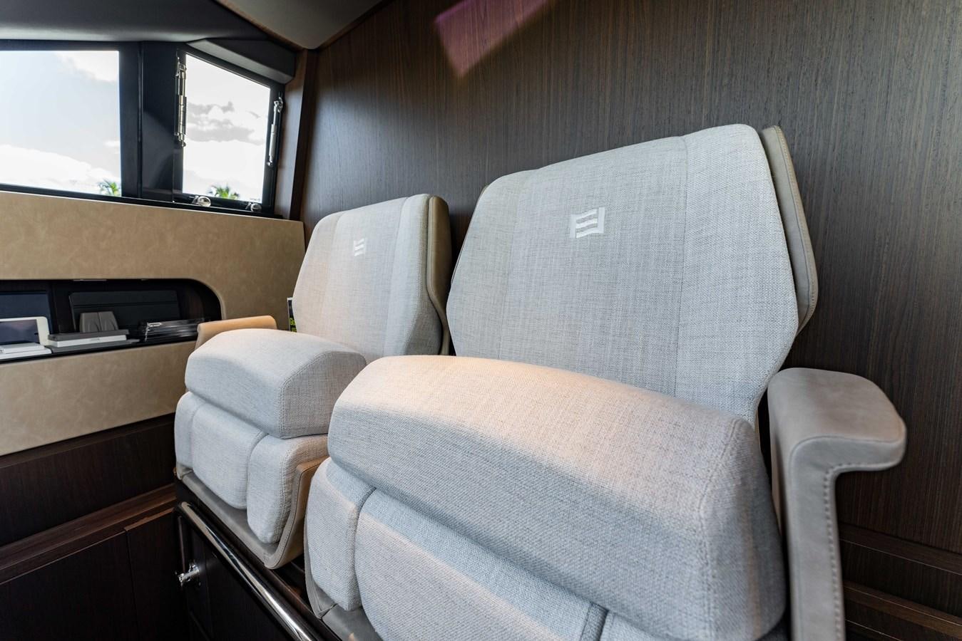 a couple of chairs in a room aboard VITTORIA Yacht for Sale