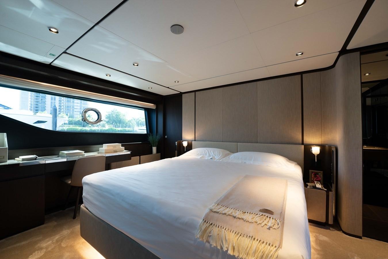 a room with a bed and a large window aboard VITTORIA Yacht for Sale
