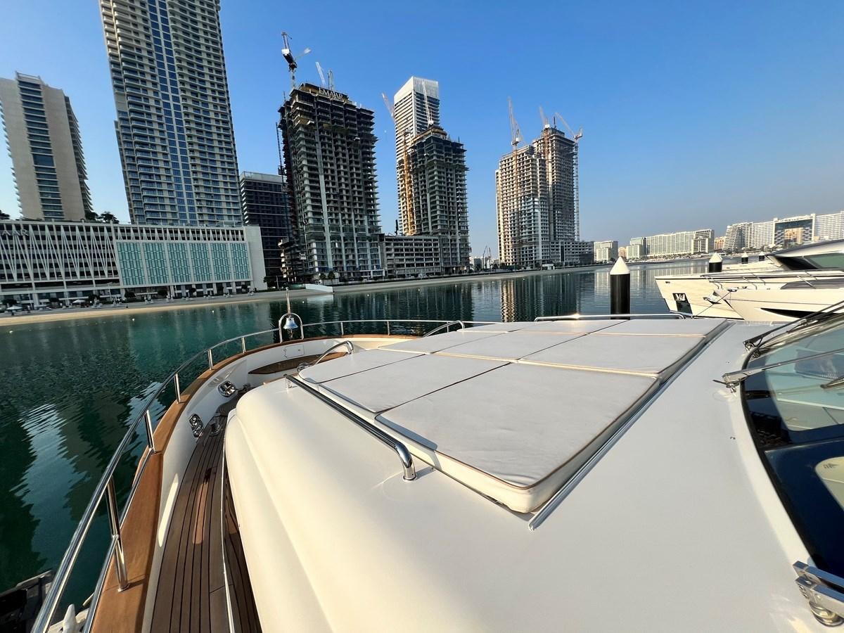 a pool with a city in the background aboard 2009 BENETTI 85 LEGEND Yacht for Sale