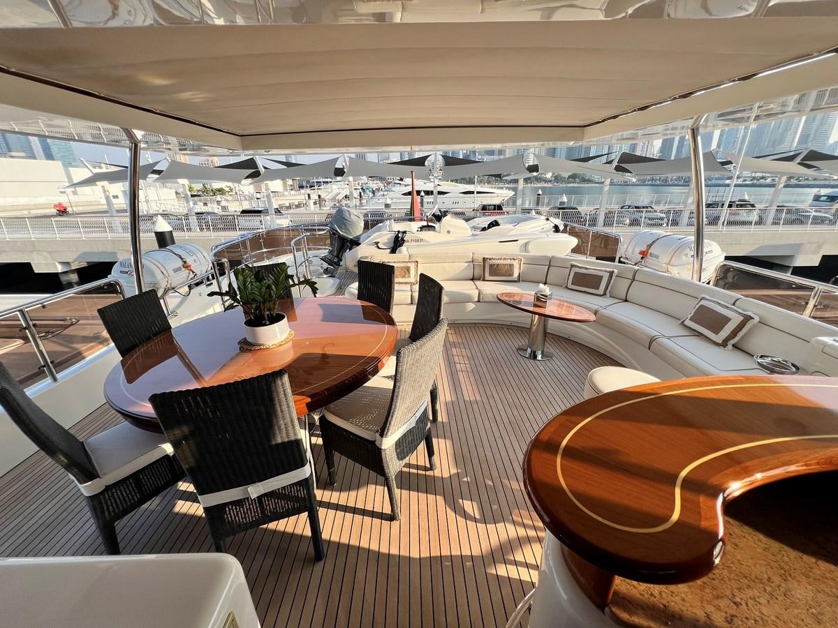 a boat with tables and chairs aboard 2009 BENETTI 85 LEGEND Yacht for Sale